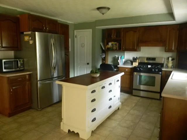 two toned kitchen cabinets with kitchen island. best kitchen remodel options -- secondhand craigslist kitchen remodel, Binkies and Briefcases on Bekob