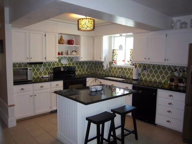 White Kitchen Remodel With Beadboard Cabinets And Stenciled Backsplash