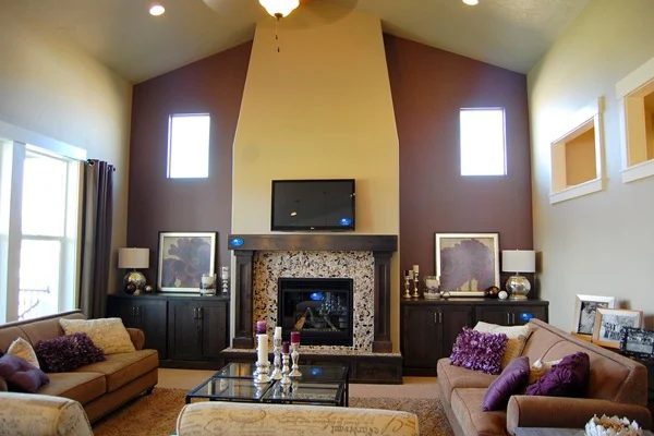 Hardrock Homes purple accent wall with fireplace