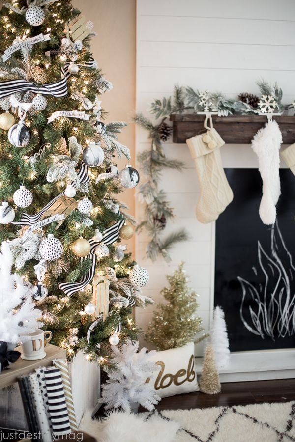 This gold Christmas is so striking! Love the mantel and the faux fireplace.