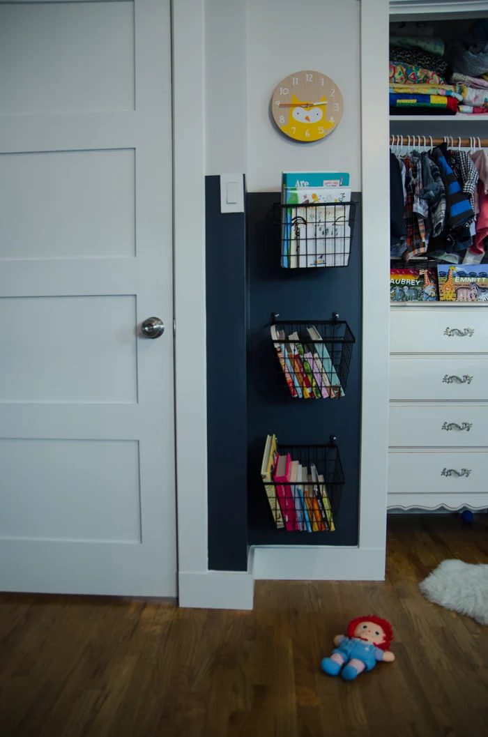 Books on Hooks- such a clever storage solution for a useless corner!