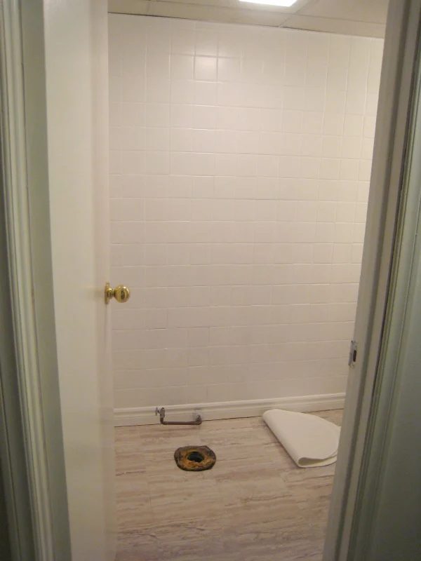 Bathroom makeover with painted tile and new floors by The Learner Observer on Bekob.com