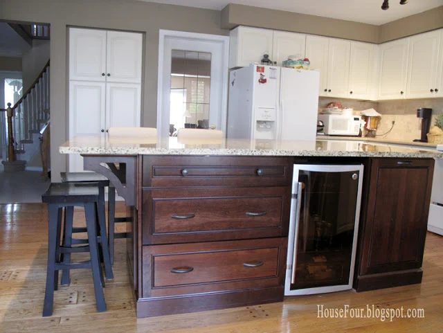 new kitchen island with built-in fridge and bookshelf, House for Four via Bekob.com