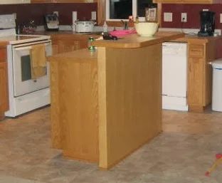 basic builder kitchen island before the makeover, featured on Bekob