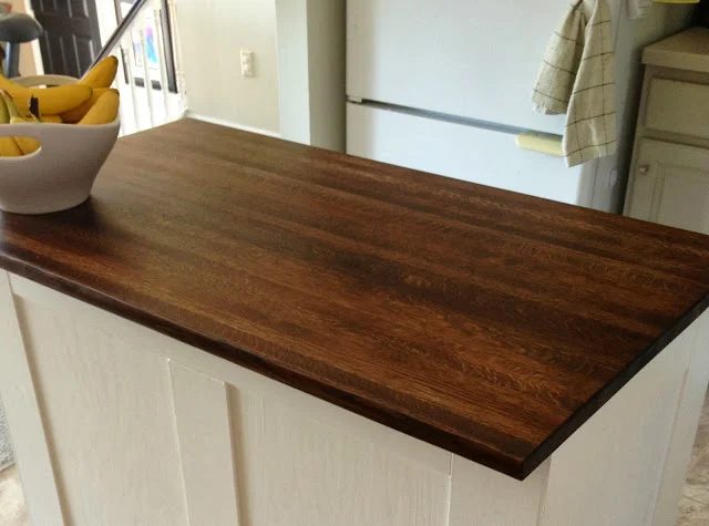 new butcher block top for the board and batten kitchen island, featured on Bekob
