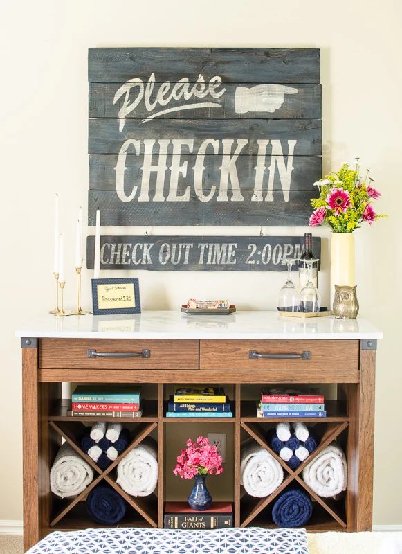 Handmade Vintage Hotel Guest Room Sign. Made using inexpensive fence pickets, plus a layered aged wood effect and an straightforward stencil.