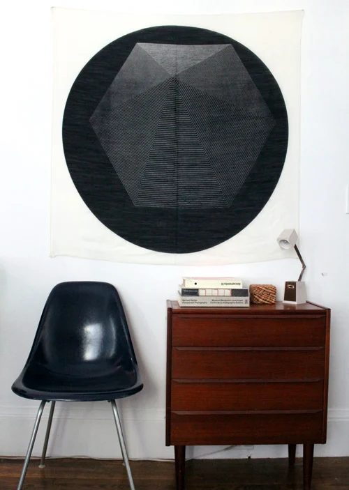 straightforward Handmade Wall Decor: hang an extra large scarf for inexpensive wall art (via Design Sponge)
