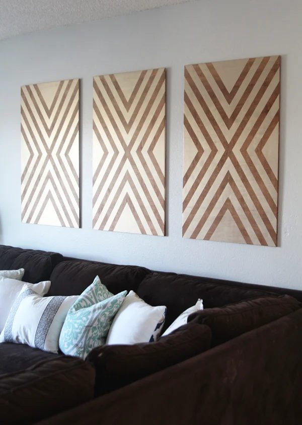 handmade large wall art from plywood, tape, and paint (via Home Depot)