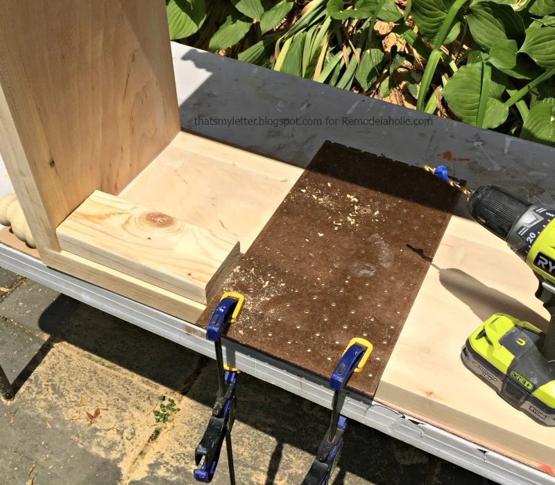 how to build a bookshelf with adjustable shelves, using pegboard as a guide for shelf pin holes