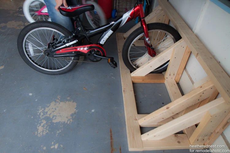 straightforward Handmade bike rack walkthrough to organize your garage NOW! Bekob.com via heatherednest.com