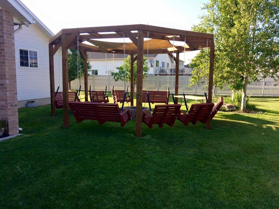 Handmade round pergola with firepit and shade screen featured on @Bekob