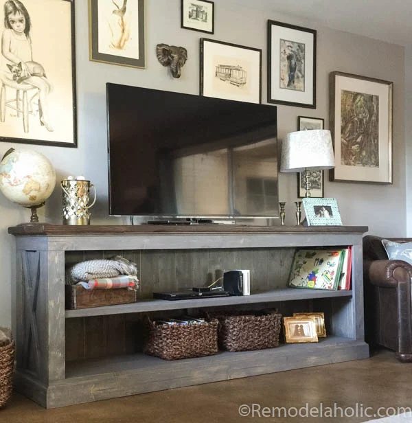 This farmhouse TV console is well fitted for storing your electronics, or use it in the dining room as a sideboard to hold serving dishes and decor. Designed by The Gritty Porch wi