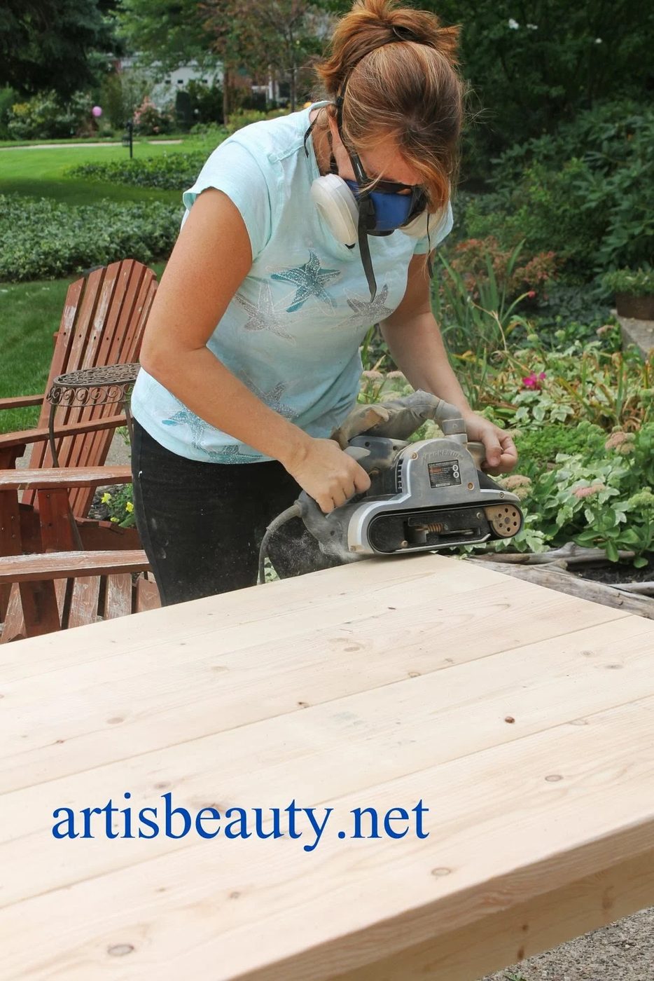 belt sander to round down and age the corners of the handmade farmhouse table, featured on Bekob.com
