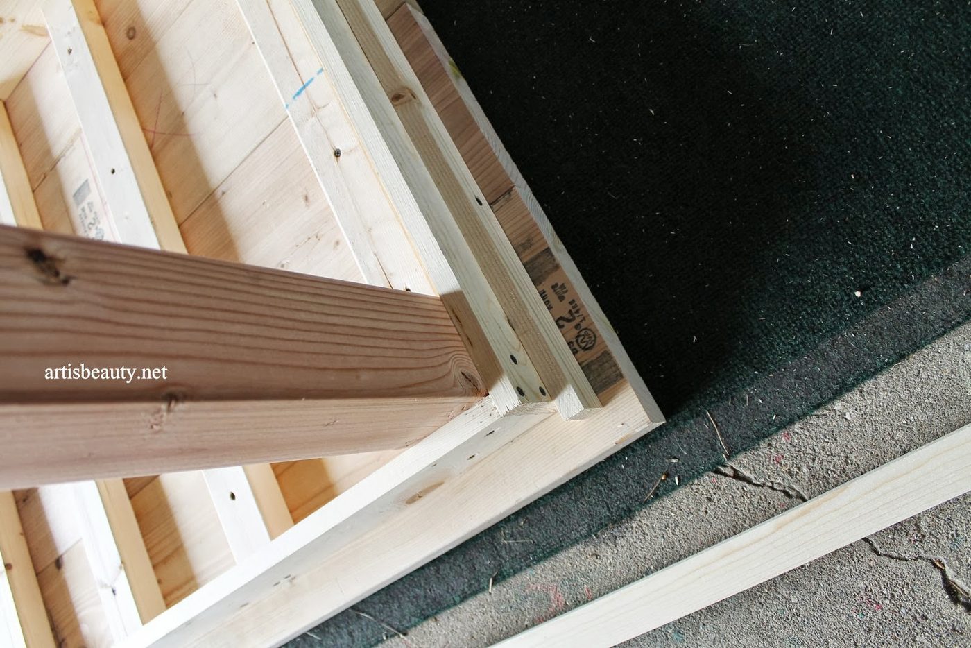 add a decorative skirt to cover screw holes on a farmhouse table, featured on Bekob.com