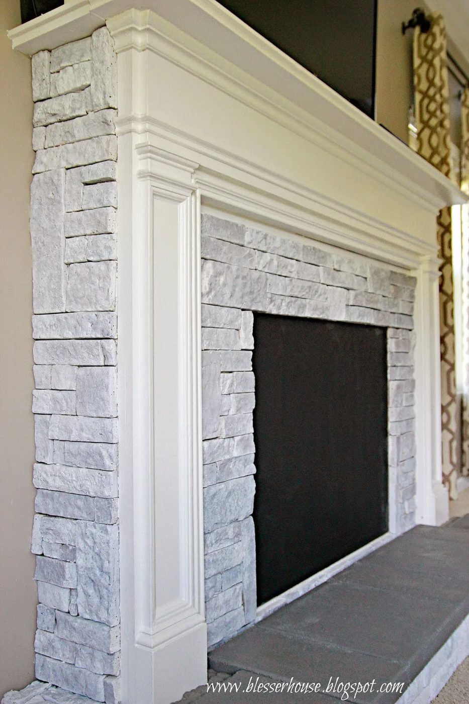 white painted airstone faux fireplace - Blesser House featured on @Bekob