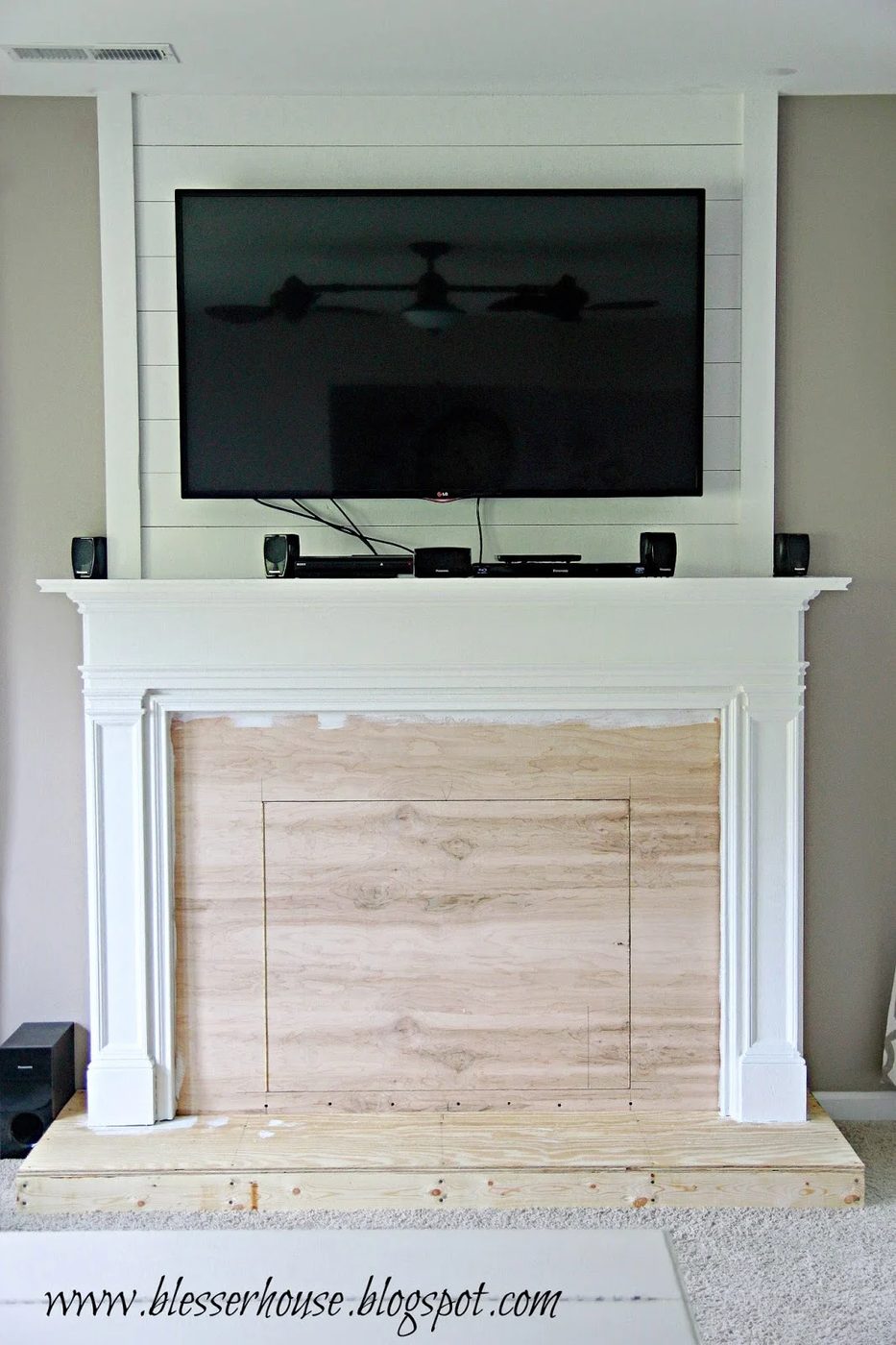 painting the faux fireplace - Blesser House featured on @Bekob