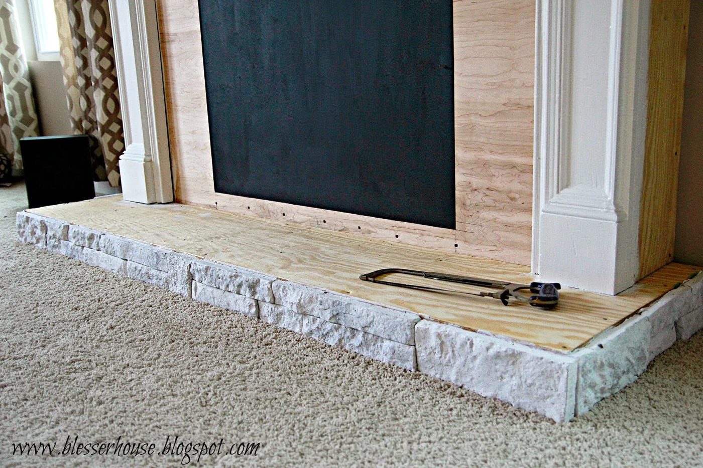 whitewashed airstone on Handmade faux fireplace - Blesser House featured on @Bekob