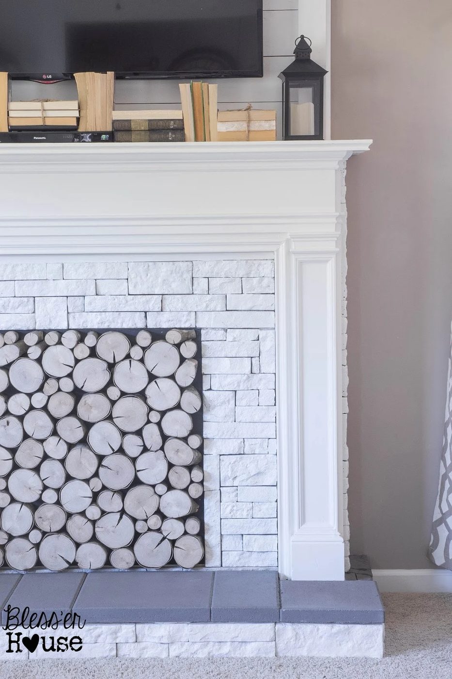 white airstone and concrete faux fireplace walkthrough - Blesser House featured on @Bekob