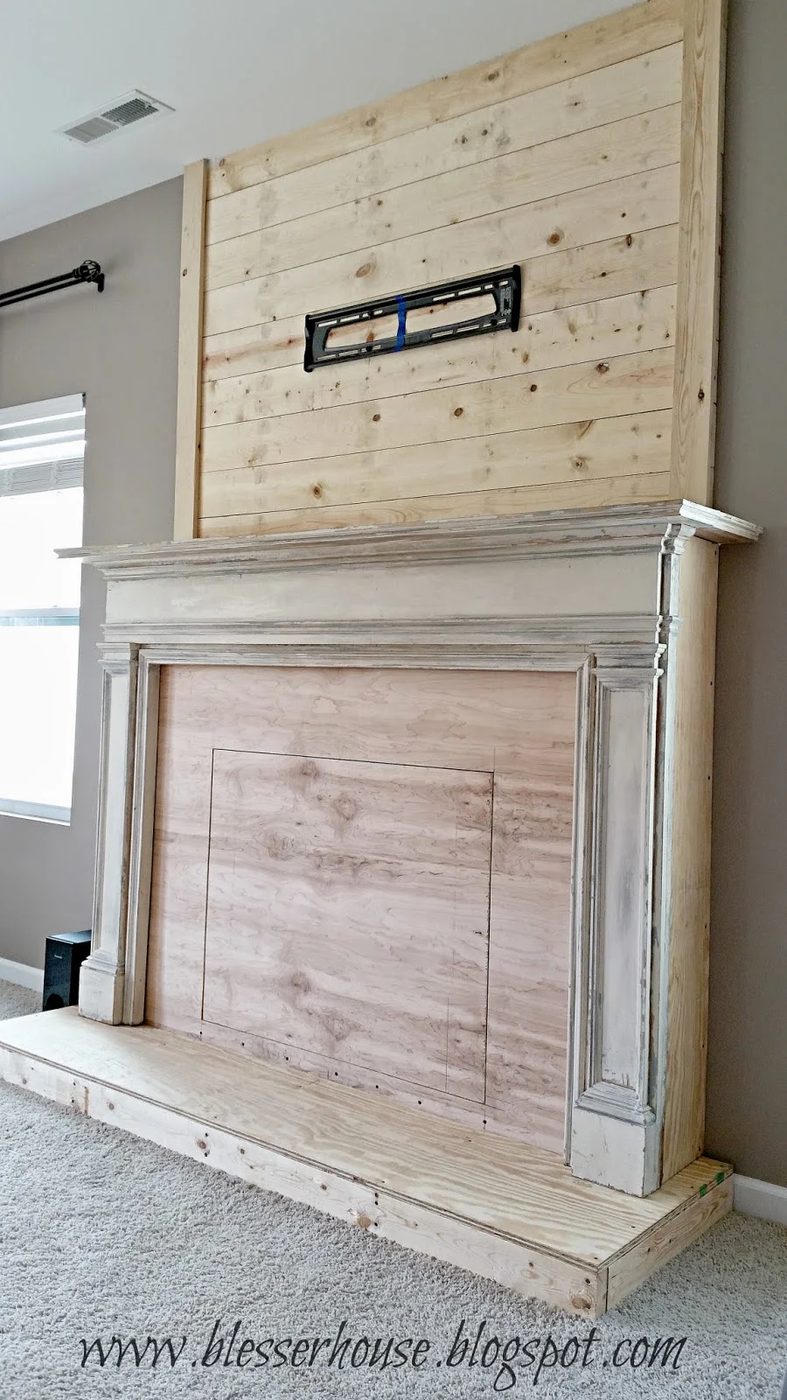 Handmade faux fireplace with plank wall chimneypiece - Blesser House featured on @Bekob
