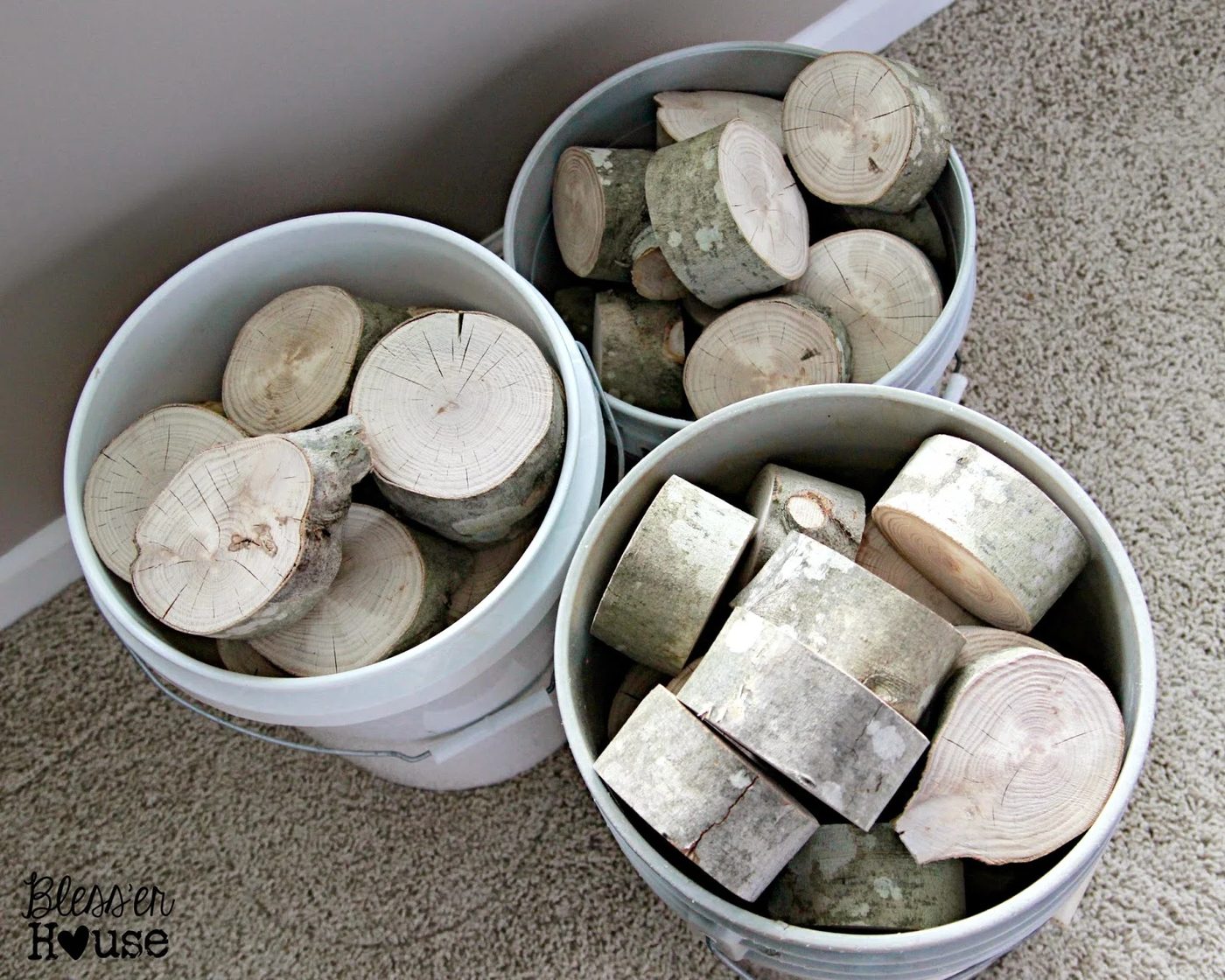 handmade stacked log frontpiece of faux fireplace - Blesser House featured on @Bekob