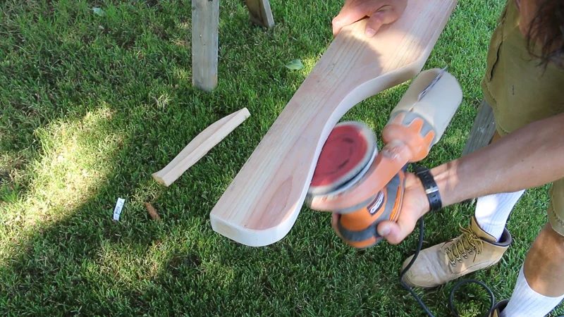 cut and sand curved wood pieces for wedding arbor arch