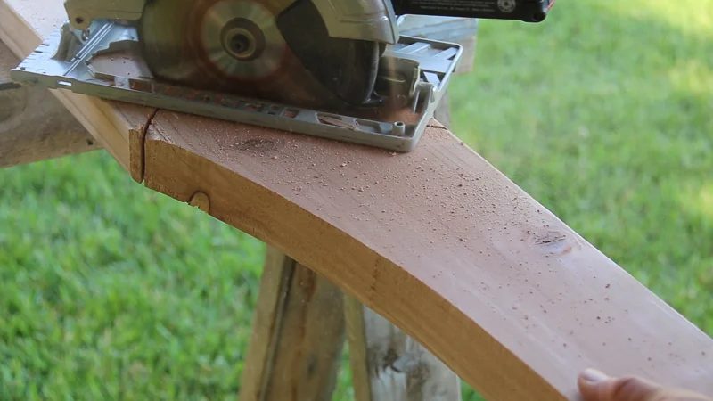 Creating a curved arch on a direct wood arbor for a backyard wedding arch