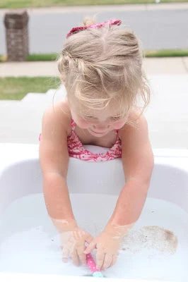 Summer water fun with a Handmade sand and water table using a discarded kitchen sink by Tattered and Inked featured on @Bekob
