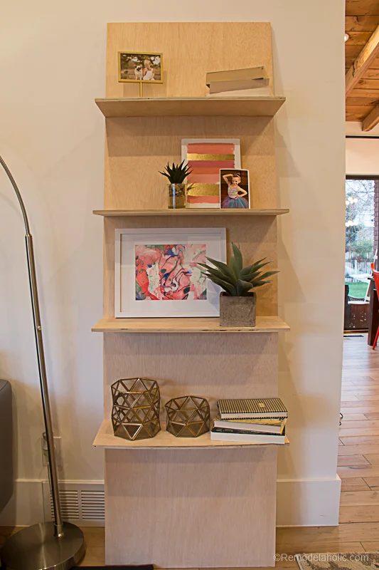 Build a minimalist plywood leaning shelf from just one sheet of plywood. well fitted for displaying photos and other lightweight home decor. #PlywoodPretty @Bekob