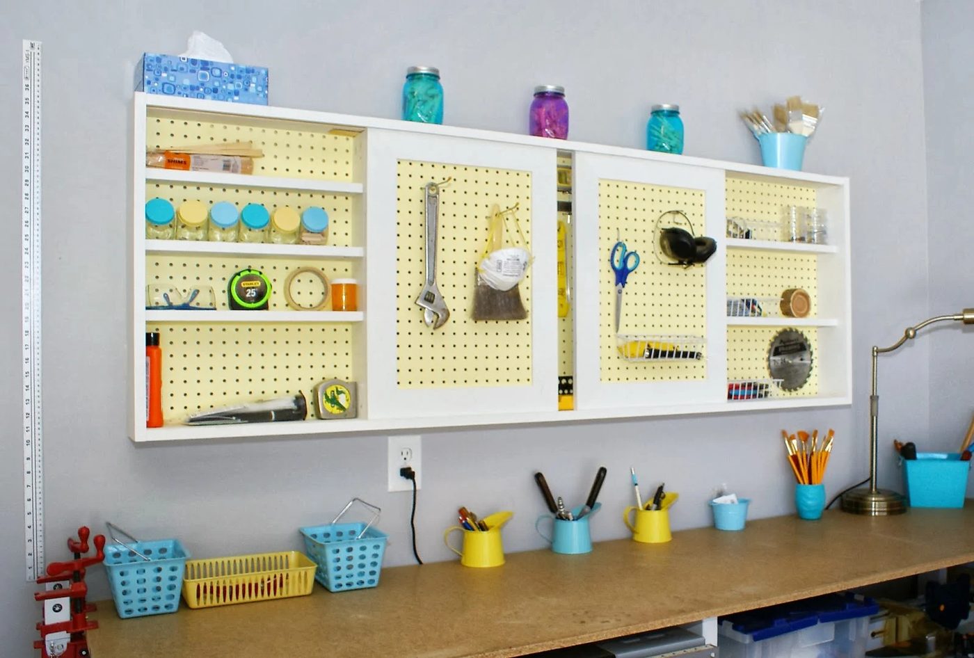 Handmade walkthrough - pegboard tool cabinet with sliding doors, featured on Bekob.com