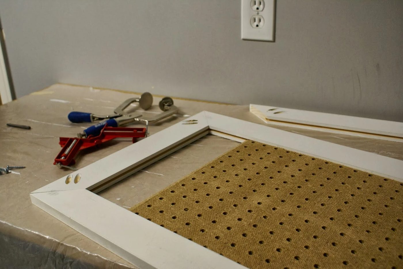 installing pegboard in doors of tool cabinet, featured on Bekob.com