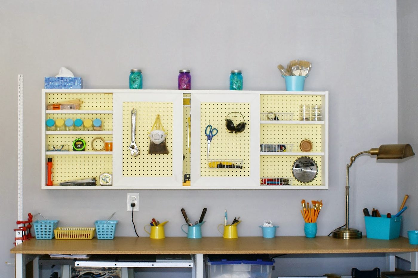 Handmade organized pegboard tool cabinet and workbench.com