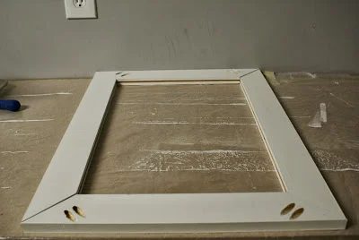 assembling the doors of the wall-mounted tool cabinet, featured on Bekob.com