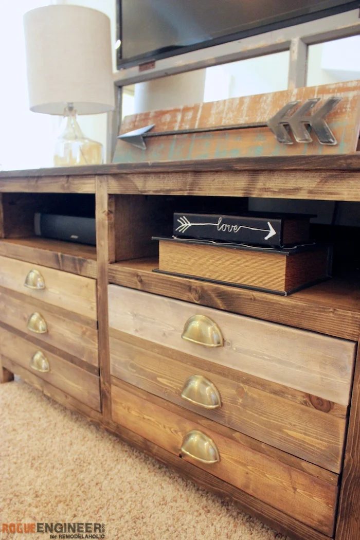 How to build a Handmade media console, designed to look like a printmaker's table. Opens shelving plus 3 spacious drawers gives plenty of storage.