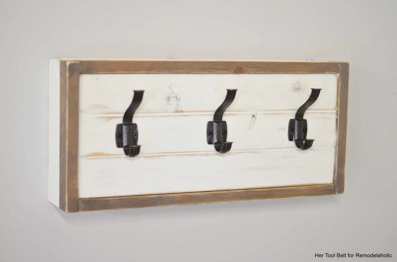 Build a farmhouse style coat rack with a secret compartment to hide small items.