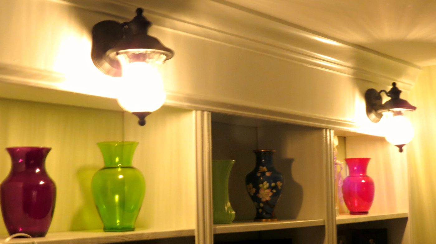 colorful glass and lighted sconces on built-in bookcase, Home Is Where My Heart Is featured on Bekob