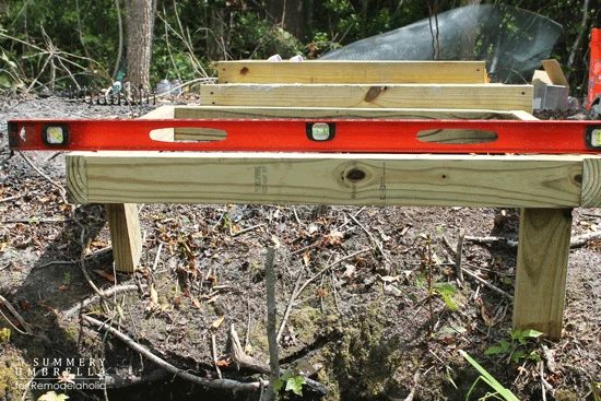 building a custom Handmade waterfall in a pond - build the cascading waterfall frame from lumber