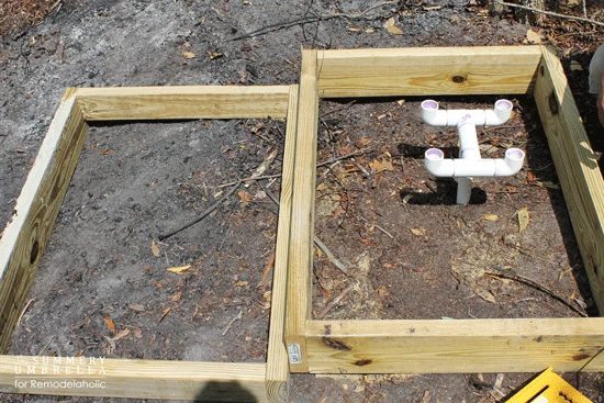 building a custom Handmade waterfall for a backyard pond - cascading waterfall frame structure with homemade PVC pipe fountain head