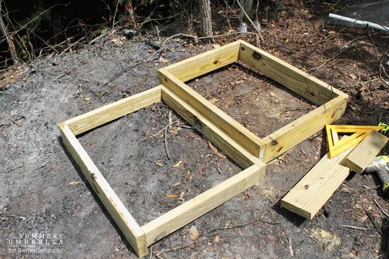building a custom Handmade waterfall in a pond -- the wood frame to support the waterfall
