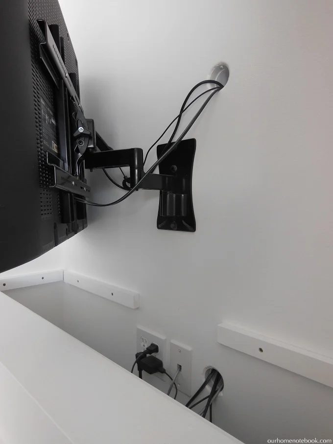 TV and Fireplace Built In that Hides the Cords by Our Home Notebook featured on Bekob