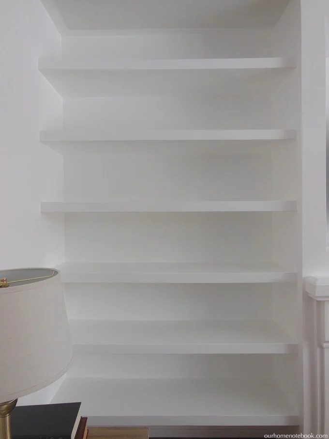 Creating a TV and Fireplace Built In with Floating Shelves by Our Home Notebook featured on Bekob
