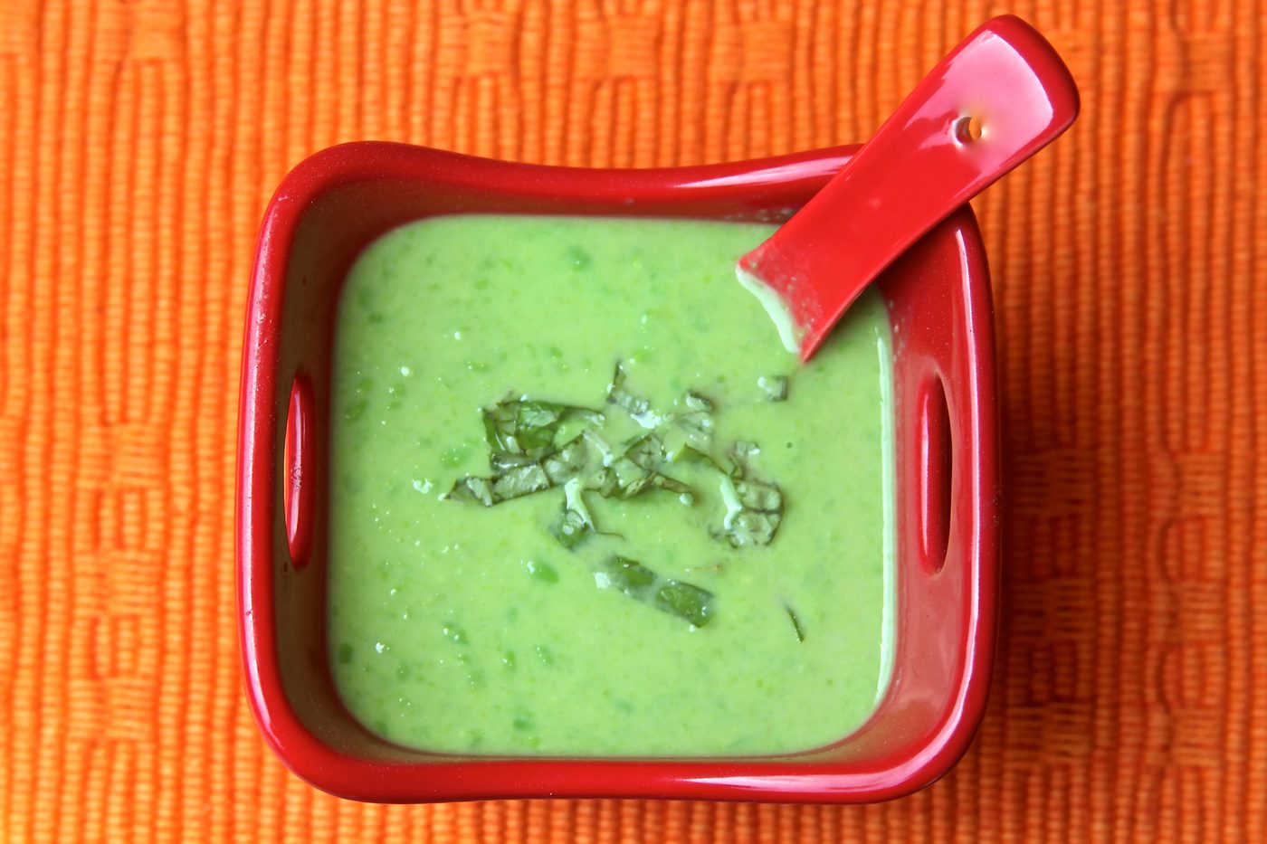 A bowl of pea and basil soup