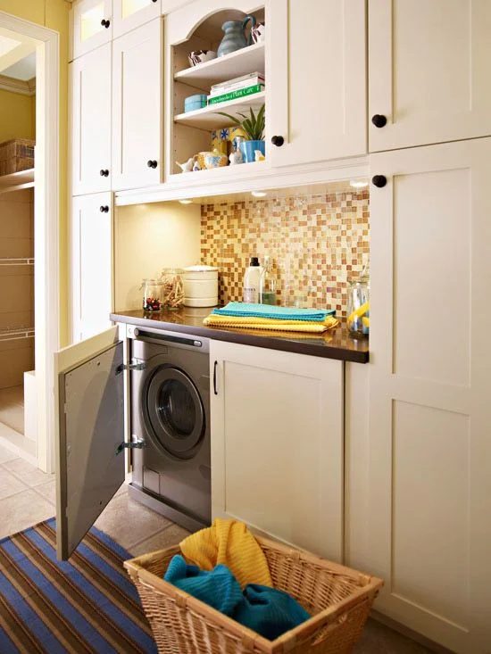 Hidden built in Laundry Space with machines in cabinets featured on Bekob.com