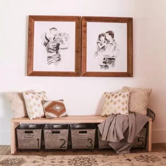 Entryway With Wooden Bench And Metal Numbered Bins Beneath With Family SKetches Above