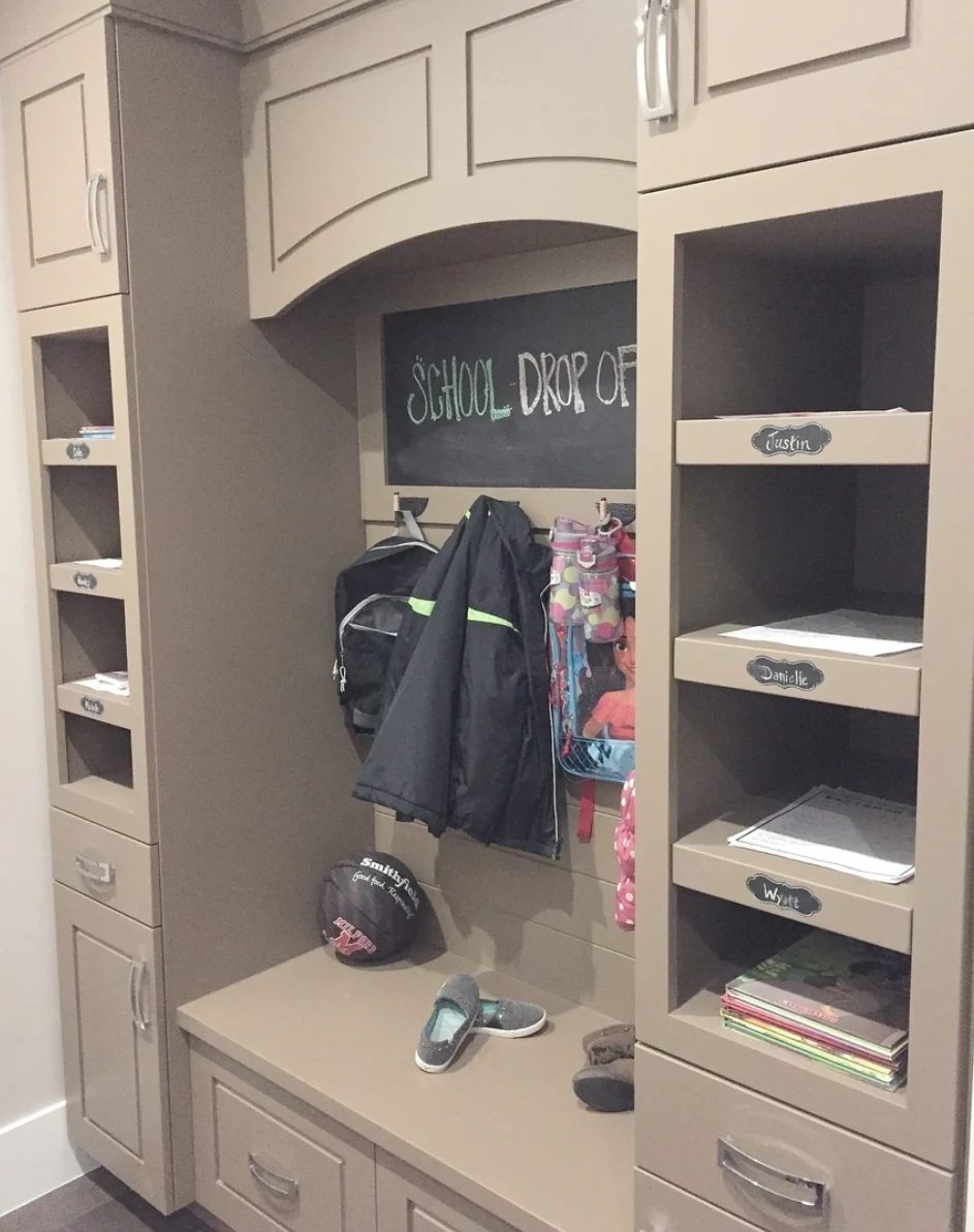 Built In Cubbies With Hooks For Backpacks And Coats, Cupboards And Built In Shelves For Papers And Books And A Bench