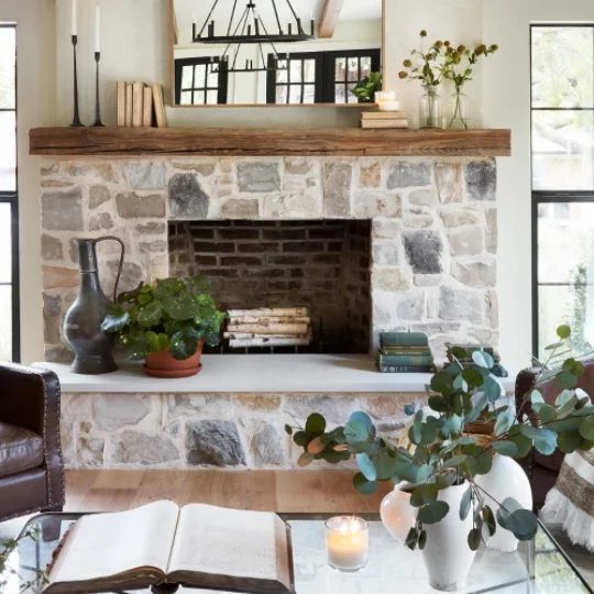 Rock Fireplace With Wooden Shelf And Plants