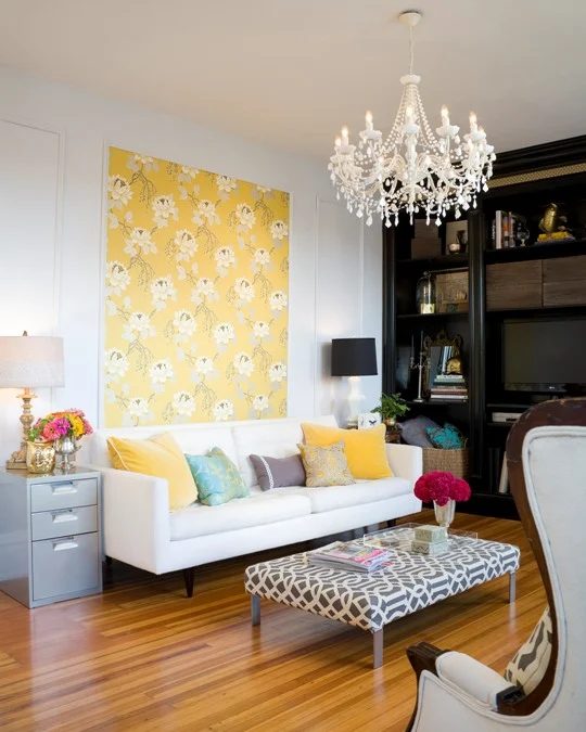 colorful casual living room with yellow patterned accent wall, Design Sponge