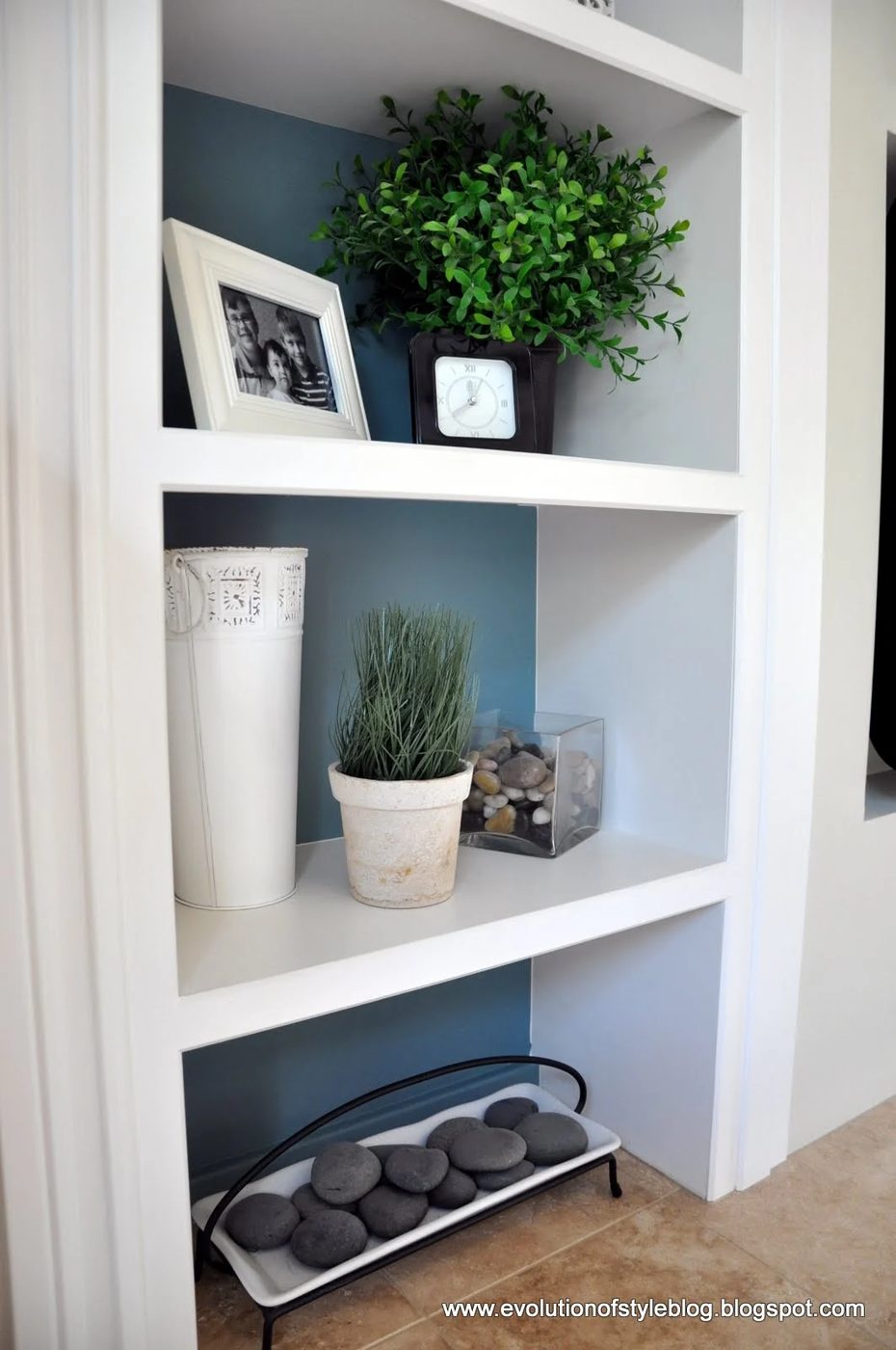 Inside of Bookshelves Painted with Aegean Tel Benjamin Moore. Color Spotlight on Bekob. Image via Evolution of Style