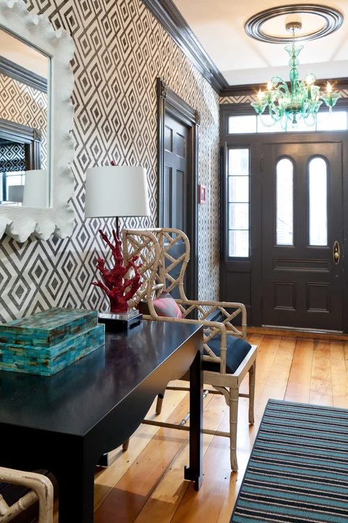 A bold modern entry! Classic almost black doors and and trim painted with Benjamin Moore Wrought Iron.