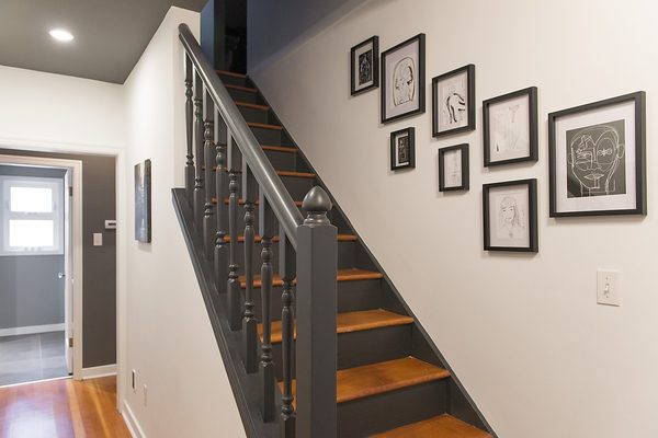 I love this dark two tone stair and deep gray, almost black, stair rail. Paint color is Benjamin Moore Wrought Iron.