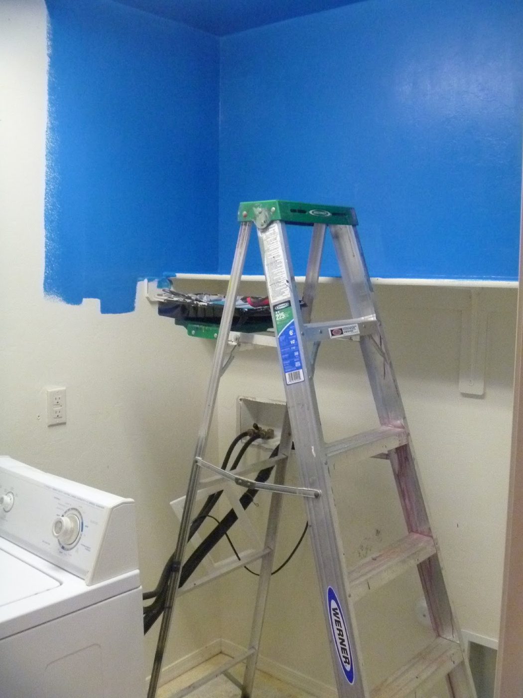 striking Blue Laundry Room Makeover Laundry storage (3)